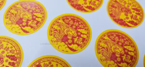 CNY Stickers, Red with White Underlay on Sand Gold Material