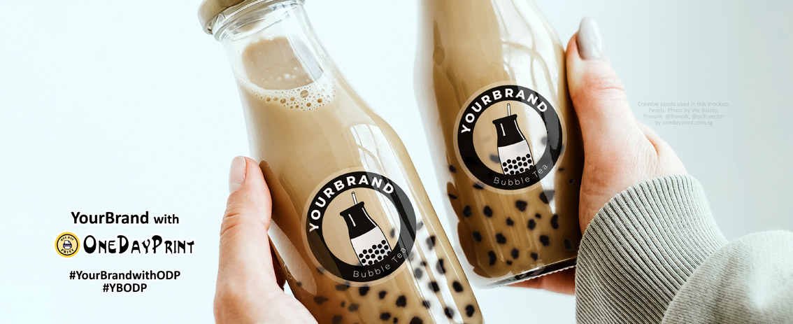 #YourBrandwithODP - Mockup Photo of Transparent Stickers with White Ink Printing on bottles, by onedayprint.com.sg, Photo by Vie Studio from Pexels, Assets from freepik were used.
